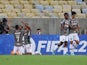 Fluminense's Cristiano celebrates scoring their first goal with teammates on April 6, 2022