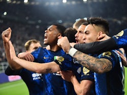Inter Milan players celebrate after Hakan Calhanoglu scores their first goal from the penalty spot on April 3, 2022