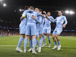 Manchester City's Kevin De Bruyne celebrates scoring their first goal with teammates on April 5, 2022