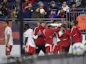 The New York Red Bulls celebrate after an own goal by New England Revolution during the second half at Gillette Stadium on April 3, 2022