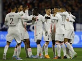 Paris Saint-Germain's (PSG) Neymar celebrates scoring their first goal with teammates on April 9, 2022