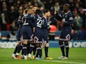 Paris Saint-Germain (PSG)'s Neymar celebrates scoring their first goal with teammates on April 3, 2022
