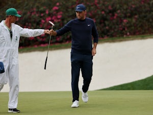 Scheffler takes control at Masters, Woods makes cut