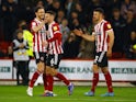 Sheffield United's Oliver Norwood celebrates scoring their first goal with with teammates on April 5, 2022