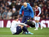 Matt Doherty goes down injured for Tottenham Hotspur against Aston Villa on April 9, 2022