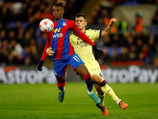 Crystal Palace's Wilfried Zaha in action with Arsenal's Granit Xhaka Action on April 4, 2022