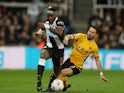 Newcastle United's Allan Saint-Maximin in action with Wolverhampton Wanderers' Joao Moutinho on April 8, 2022