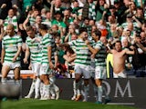 Celtic's Greg Taylor celebrates scoring their first goal with teammates on April 17, 2022