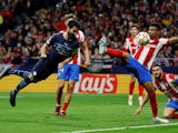 Manchester City's Ilkay Gundogan in action with Atletico Madrid's Renan Lodi on April 13, 2022 