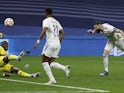 Real Madrid forward Karim Benzema scoring against Chelsea in the Champions League on April 12, 2022