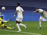 Real Madrid forward Karim Benzema scoring against Chelsea in the Champions League on April 12, 2022