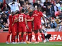 Liverpool's Sadio Mane celebrates scoring their third goal with teammates on April 16, 2022