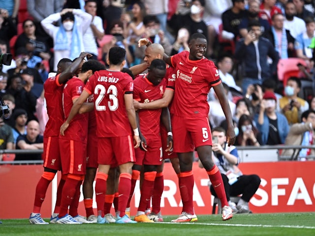 Liverpool's Sadio Mane celebrates scoring their third goal with teammates on April 16, 2022