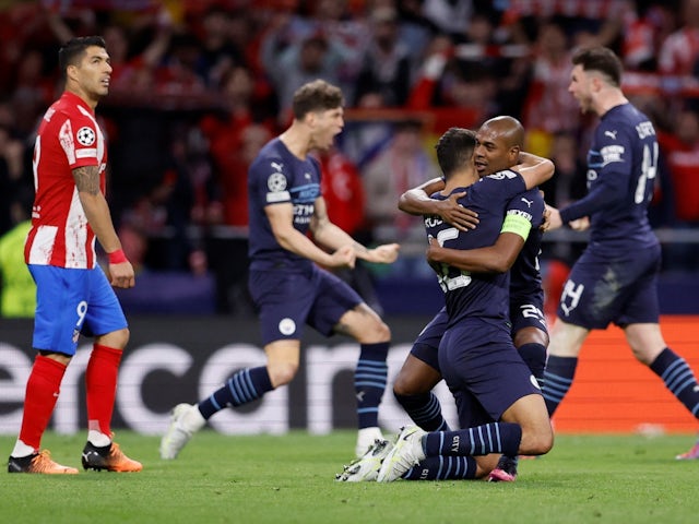 Manchester City's Rodri celebrates with Fernandinho after the match on April 13, 2022