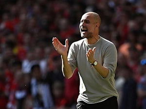 Guardiola defends making seven changes after Liverpool defeat