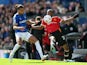 Manchester United's Aaron Wan-Bissaka in action with Everton's Dominic Calvert-Lewin on April 9, 2022