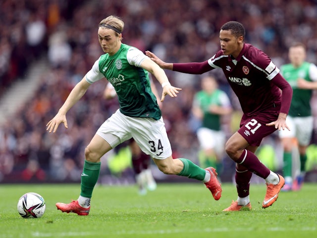 Hibernian's Elias Melkersen in action with Hearts' Toby Sibbick on April 16, 2022