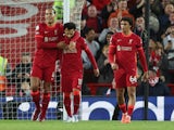 Liverpool's Mohamed Salah celebrates scoring their second goal with teammates on April 19, 2022
