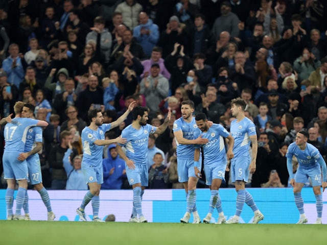 Manchester City's Riyad Mahrez celebrates scoring their first goal with teammates on April 20, 2022