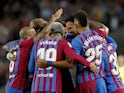 Barcelona's Sergio Busquets celebrates scoring their second goal with teammates on May 1, 2022
