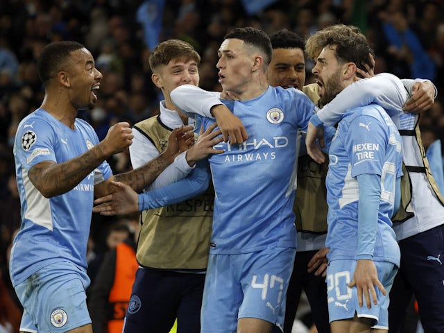 Manchester City's Bernardo Silva celebrates scoring their fourth goal with teammates on April 26, 2022