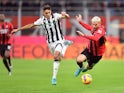 Udinese's Nahuel Molina in action with AC Milan's Theo Hernandez on February 25, 2022