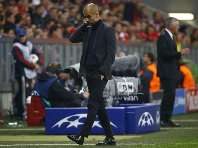 Bayern Munich's Pep Guardiola reacts during their Champions League semi-final second-leg defeat against Real Madrid on April 29, 2014