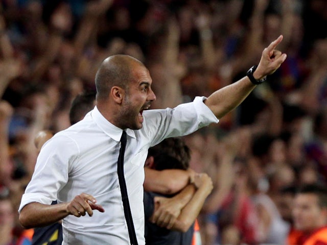 Barcelona's Pep Guardiola celebrates a goal against Real Madrid during their Spanish Supercup second leg at Camp Nou on August 17, 2011