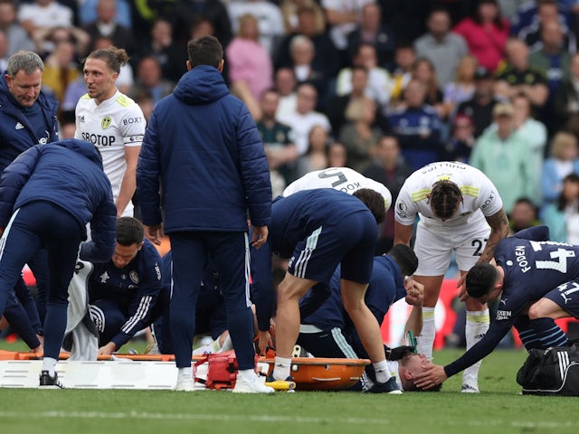 Leeds United's Stuart Dallas receives medical attention after sustaining an injury on April 30, 2022