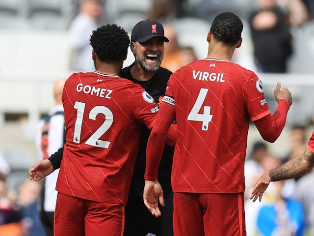 Liverpool manager Jurgen Klopp celebrates with Virgil van Dijk and Joe Gomez after the match on April 30, 2022