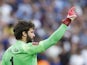 Liverpool goalkeeper Alisson Becker celebrates saving a penalty against Chelsea in the 2022 FA Cup final.