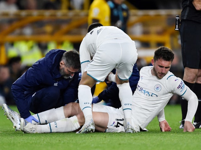 Manchester City's Aymeric Laporte receives medical attention on May 11, 2022