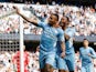Manchester City's Gabriel Jesus celebrates with Raheem Sterling after scoring their fourth goal to complete his hat-trick on April 23, 2022