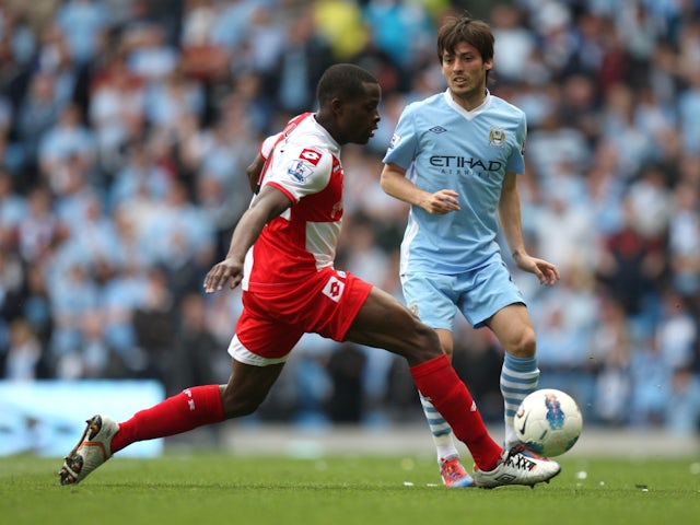 Manchester City's David Silva in action against Queens Park Rangers' Nedum Onuoha on May 13, 2012