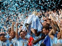 Manchester City captain Vincent Kompany lifts the Premier League trophy on May 13, 2012