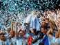 Manchester City captain Vincent Kompany lifts the Premier League trophy on May 13, 2012
