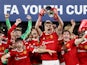 Manchester United players celebrate winning the FA Youth Cup on May 11, 2022