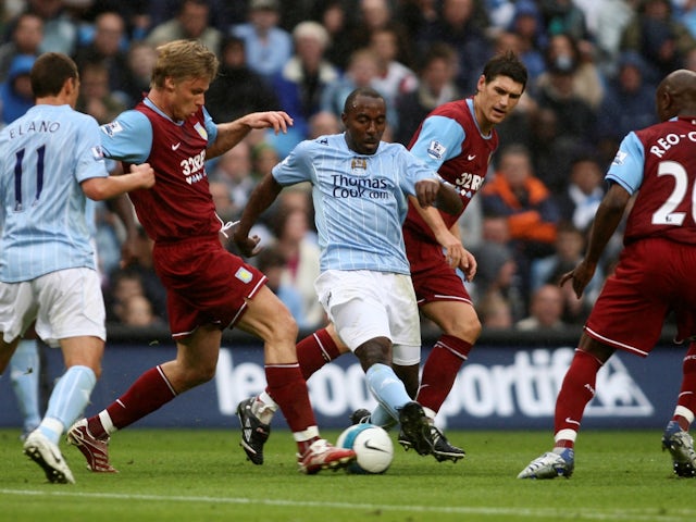 Manchester City's Darius Vassell in action with Aston Villa's Gareth Barry and Martin Laursen on September 16, 2007