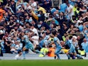 Manchester City's Ilkay Gundogan celebrates scoring their third goal with Gabriel Jesus and Phil Foden on May 22, 2022