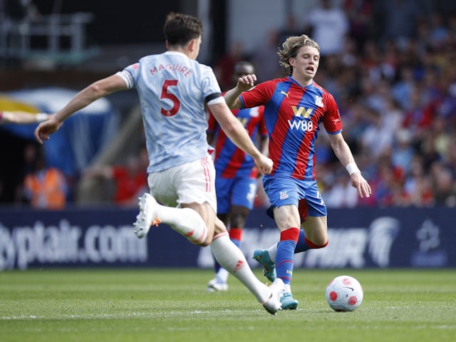 Crystal Palace's Conor Gallagher in action with Manchester United's Harry Maguire on May 22, 2022