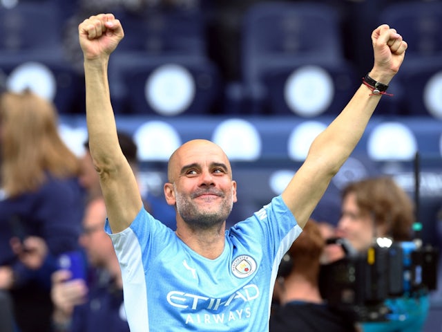 Manchester City manager Pep Guardiola celebrates after winning the Premier League title on May 22, 2022