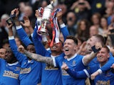 Rangers' James Tavernier celebrates with the trophy after winning the Scottish Cup final on May 21, 2022