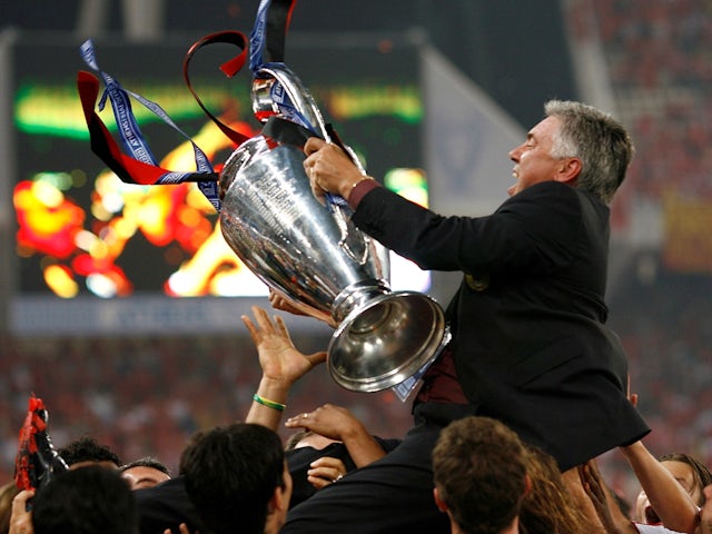AC Milan's manager Carlo Ancelotti celebrates with the Champions League trophy after winning the final on May 23, 2007