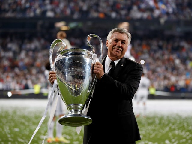 Real Madrid's manager Carlo Ancelotti poses with the Champions League trophy on May 25, 2014