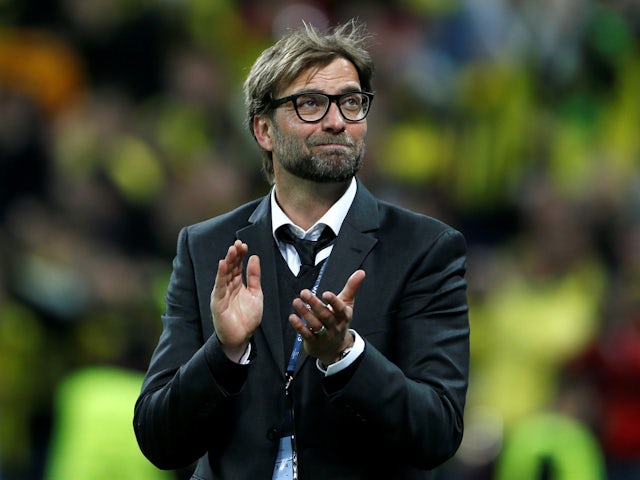 Borussia Dortmund's boss Juergen Klopp applauds supporters after losing the Champions League final on May 25, 2013