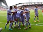 Leeds United's Jack Harrison celebrates scoring their second goal with teammates on May 22, 2022