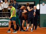 Alexander Zverev walks off the court injured against Rafael Nadal in the French Open on June 3, 2022