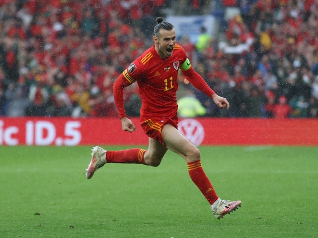 Wales forward Gareth Bale celebrating scoring with a deflected free kick against Ukraine on June 5, 2022.