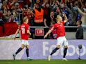 Norway's Erling Braut Haaland celebrates scoring their first goal with Martin Odegaard on June 5, 2022
