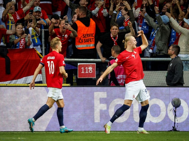 Norway's Erling Braut Haaland celebrates scoring their first goal with Martin Odegaard on June 5, 2022